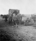 Photograph of a horse ambulance collecting wounded soldiers at an advanced Field Dressing Station, the Somme (Fler-Courcelette), September 15, 1916