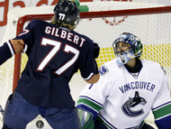 Tom Gilbert (77) scores on Roberto Luongo in Tuesday's 5-4 Oilers win. 