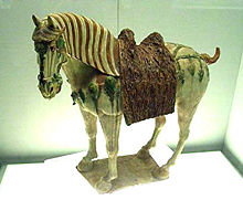 A Tang Dynasty tri-color Chinese glazed horse circa 700 CE
