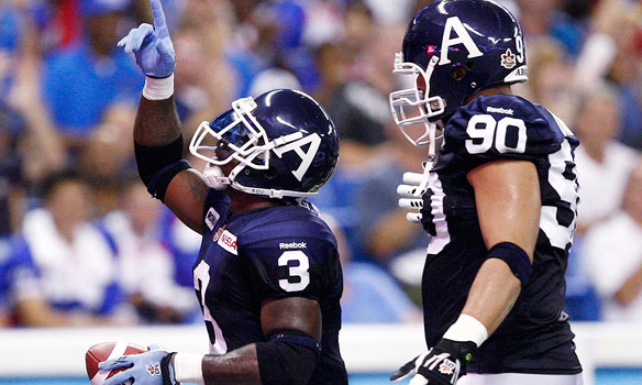Toronto Argonauts running back Cory Boyd, left, celebrates his touchdown against the Montreal Alouettes with teammate Adrian Davis. Boyd leads the league in rushing with 711 yards. 