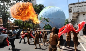 Environmental activists who are also the members of Indonesian Environmental Rides and fishermen group perform long march and theatrical action to commemorate the International Earth Day on April 22, 2013 in Surabaya, Indonesia.