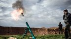 Syrian rebels fire a mortar in Al-Bab, 30km from the Syrian city of Aleppo on 14 February 2013
