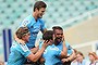 Kurtley Beale of the Waratahs celebrates with his team mates after scoring a try.