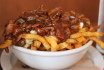 The Palmer poutine with bacon, caramelized onions, cheese curds and gravy.<br><br>Photo Credit: Jelena Subotic