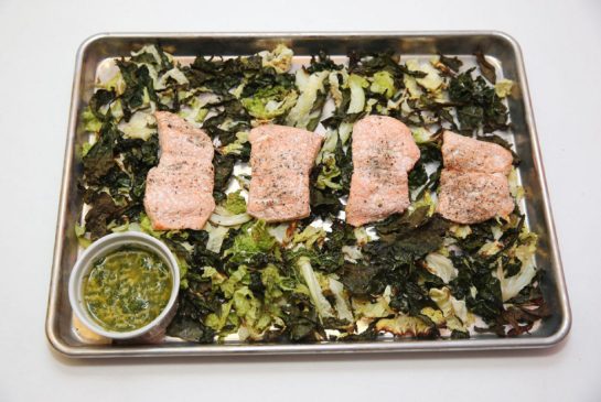 The beauty of a sheet pan supper is that you throw your protein (salmon) and vegetables (kale and cabbage) on a baking sheet and roast away. The lemon dill sauce, though, was made separately. (Vince Talotta/Toronto Star)
