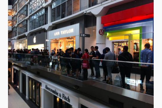 People lined up outside the Apple store at the Eaton Centre in downtown Toronto on Friday to buy the new iPhone 6s.