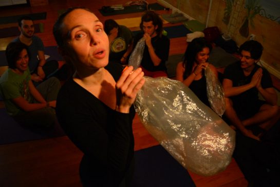Yoga teacher Lu Pancini uses a vaporizer at the start of her ganja yoga class on Bloor St. W.