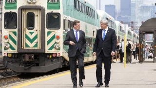 Prime Minister Stephen Harper chats with John Tory, Mayor of Toronto, prior to announcing further details regarding the new Public Transit Fund.