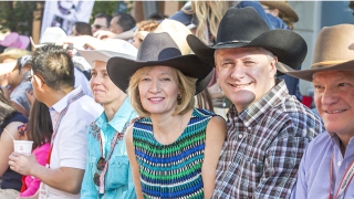 Prime Minister Stephen Harper and his wife Laureen get ready to kick off the 2015 Calgary Stampede Parade.