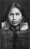 Kwagu'ł girl, Margaret Frank (nee Wilson) wearing abalone shell earrings. Abalone shell earrings were a sign of nobility and only worn by members of this class.