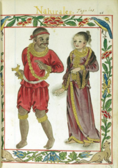 An elaborate border frames a full length illustration one would associate with a manuscript of a man and woman. The dark-skinned man dressed in a red tunic, breeches, and bandanna and wearing a gold chain is looking pleasantly over his shoulder in the direction of the fair woman who, garbed in a dark gold-fringed dress that covers the length of her body except her bare feet, has the faintest hints of a smile.