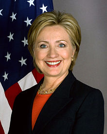 Formal portrait of Hillary Clinton with flag, 2009
