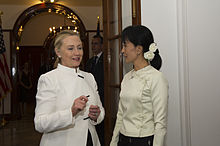 Clinton standing with Aung San Suu Kyi