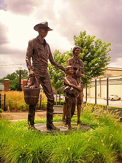 Statue of an early 20th-century family, Centennial Park on Main Street