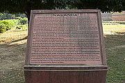 A sign detailing the history of Nalanda.
