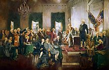 An oil-on-canvas painting of the 39 delegates sitting and standing in Independence Hall. George Washington is standing upright and looking out over the delegates.