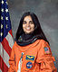 Kalpana Chawla, NASA photo portrait in orange suit.jpg