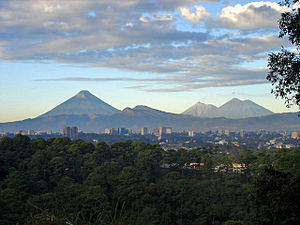 View of Guatemala City with the Agua, Fuego and Acatenango volcanoes in the background.