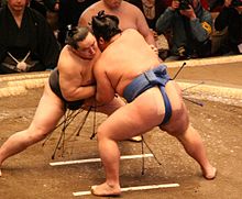 A sumo match (tori-kumi) between former yokozuna Asashōryū (left) and then-komusubi Kotoshōgiku in January 2008.