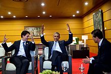 Justin Trudeau with President Barack Obama throwing hamds in air as Enrique Peña Nieto looks on