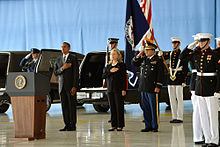 Obama and Clinton at somber occasion