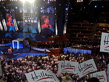 Clinton speaking before a convention audience