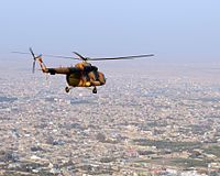 Mi-17 helicopter flies over the northern Afghan city-101113-N-5006D-582.jpg