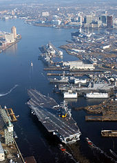The nuclear-powered aircraft carrier USS Harry S. Truman (CVN-75) transits the Elizabeth River at Norfolk Naval Shipyard.