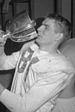 Don Getty drinking from Grey Cup.jpg