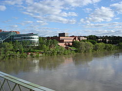 City hall, the courthouse and Medicine Hat Public Library are visible across the South Saskatchewan River, looking south from Finlay Bridge