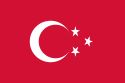 Red flag with three white crescents, each containing a five-pointed white star.