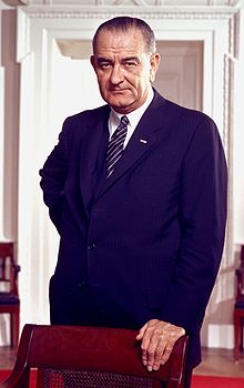 Lyndon B. Johnson, photo portrait, leaning on chair, color cropped.jpg