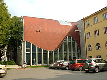 Jewish Synagogue in Tallinn with a red cylindrical rook and glass wall