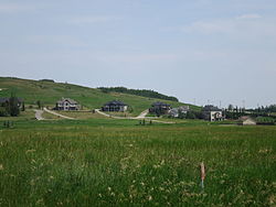 The eastern part of the hamlet of Millarville, looking ENE from Highway 549. Highways 22 is visible near the right edge of the image.