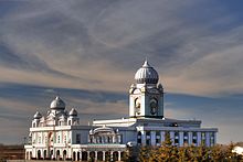 Large, ornate white building against a blue sky