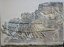 WA 124772: An Assyrian warship carved into stone (700–692 BC) from the reign of Sennacherib. Ninevah, South-West Palace, Room VII, Panel 11. British Museum.
