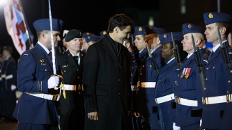 Prime Minister Justin Trudeau attends an Honour Guard at the CFB Trenton, in Ontario
