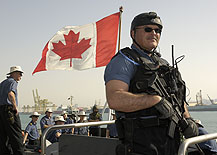 Warrant Officer Gerry Arsenault is on security duty watch onboard HMCS CHARLOTTETOWN prior to departing Abu Dhabi, United Arab Emirates.  Cpl Robert LeBlanc 