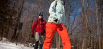 Photo of two people snowshoeing