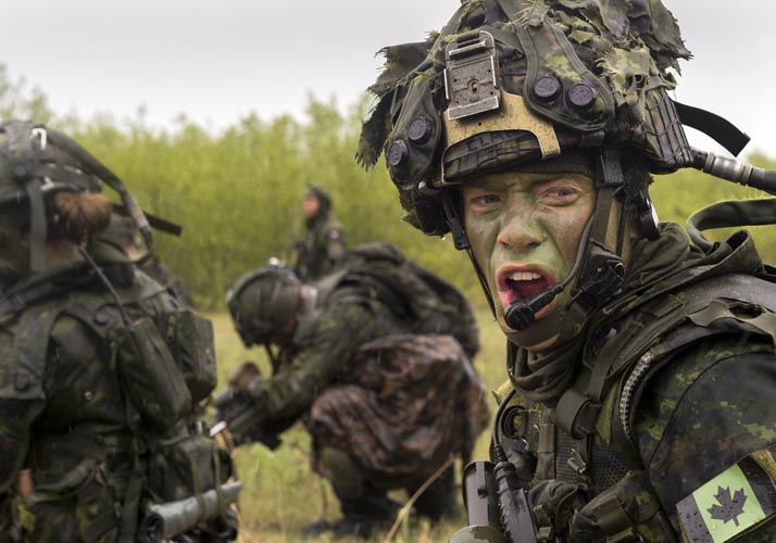 A member of The Queen’s Own Rifles of Canada yells orders to his troops while advancing on an enemy position during Exercise MAPLE RESOLVE on May 14, 2017 in Wainwright, Alberta. Photo: Garrison Imaging Petawawa PA01-2017-0146-054