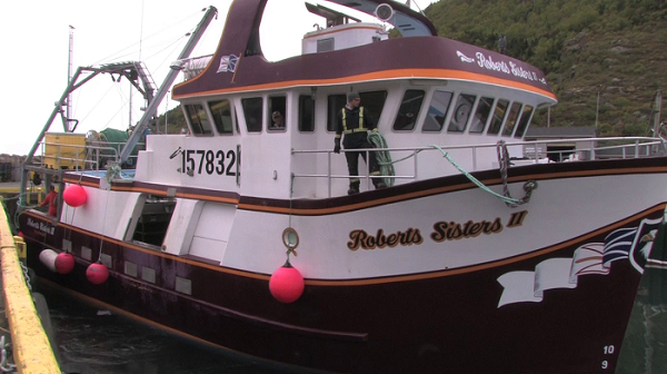Still of a vessel docking, from the Loss of life on fishing vessels video