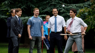 Prime Minister Justin Trudeau and Taoiseach Leo Varadkar watch a hurling demonstration at Farmleigh House in Dublin, Ireland