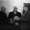 Harold W. Simpson, Fall River, left, and James Cullen, 423 Agricola street, centre, veteran employees of the Canadian Department of Agriculture, are shown above receiving gifts from George R. Smith