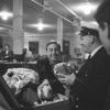 Immigration officer inspecting luggage at Pier 21, 1965.
