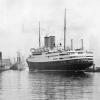 The German liner Berlin, the first of four passenger ships scheduled to call here over the weekend, is shown as she moved alongside of Pier 21 this morning to disembark 189 passengers.
