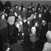It was a happy day for 347 Baltic refugees aboard the tiny ship Walnut who arrived in Halifax yesterday from Gothenburg, Sweden. Jammed-packed aboard the 350-ton ship - a passenger for every ton - a group of the passengers is shown above shortly after arrival at this port. (Norwood photo)