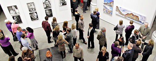 An overhead view of visitors in an exhibition.