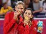 Canada's Sarah Pavan, left, and Melissa Humana-Paredes celebrate after winning the gold medal in women's beach volleyball during the 2018 Commonwealth Games on the Gold Coast, Australia, Thursday, April 12, 2018. Canada won gold, Australia silver and Vanuatu won bronze.