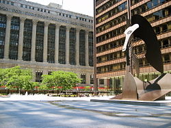 The century-old, neoclassical County and City Hall building (left) in the Chicago Loop houses the County Board chambers and administrative offices. The Chicago Picasso stands in front of Daley Center, the home of Cook County Circuit Court.