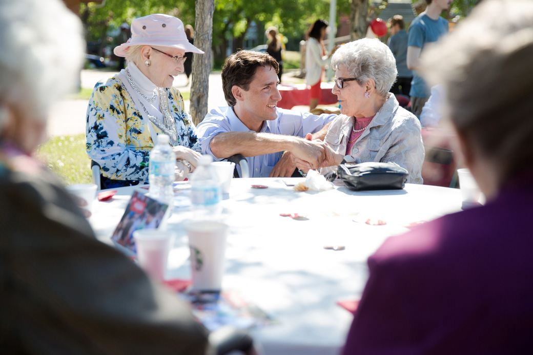 Prime Minister Trudeau meets with senior citizens at an outdoor event